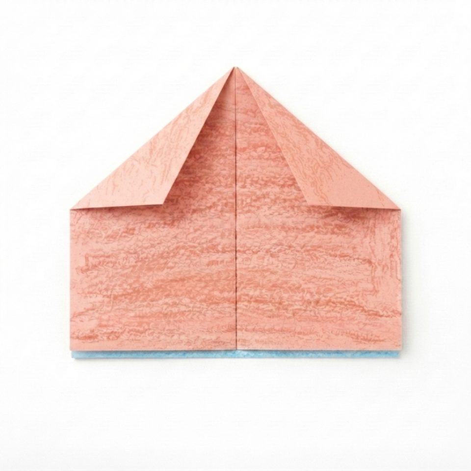 A paper house shape with coral folded top corners meeting at the centre and a blue edge at the bottom.