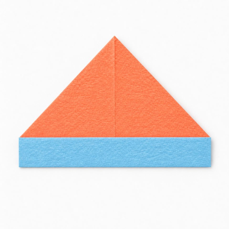A flat coral paper hat with a sky-blue folded band along the bottom.
