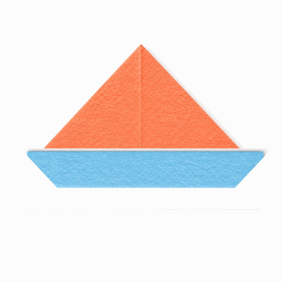 A coral paper triangle above a blue folded lower layer.