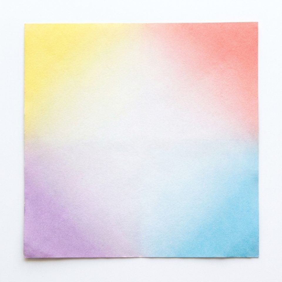 A square paper sheet with yellow, coral, purple and blue coloring at its corners.